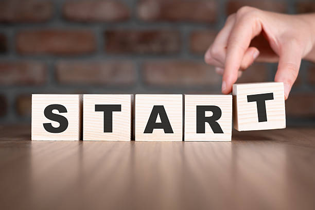 Start word with wooden blocks on table