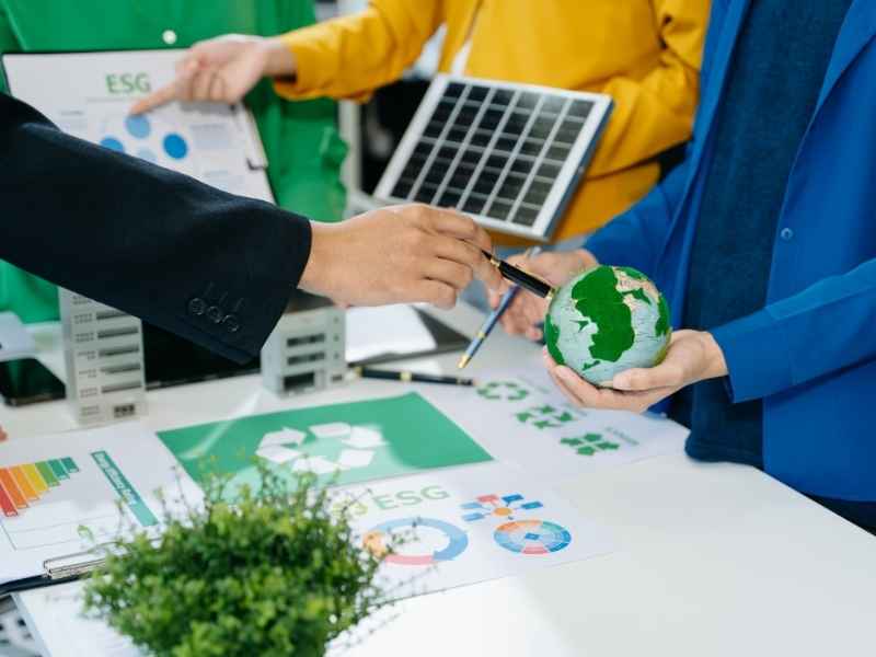 Corporate team discussing ESG strategies and sustainable practices, emphasizing how ethical governance strengthens Building Investor Confidence.