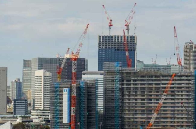 Expanding urban skyline showing infrastructure development and economic growth in modern cities