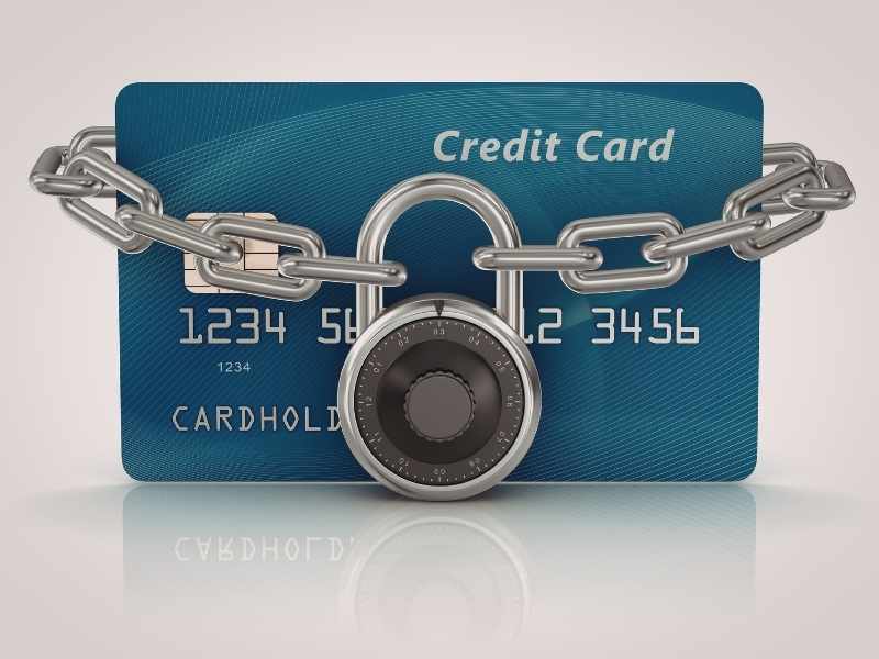 redit card with a padlock, symbolizing protecting accounts and managing credit card debt safely.