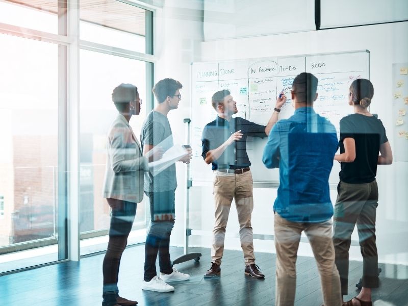 University researchers and company professionals collaborate on an applied project.