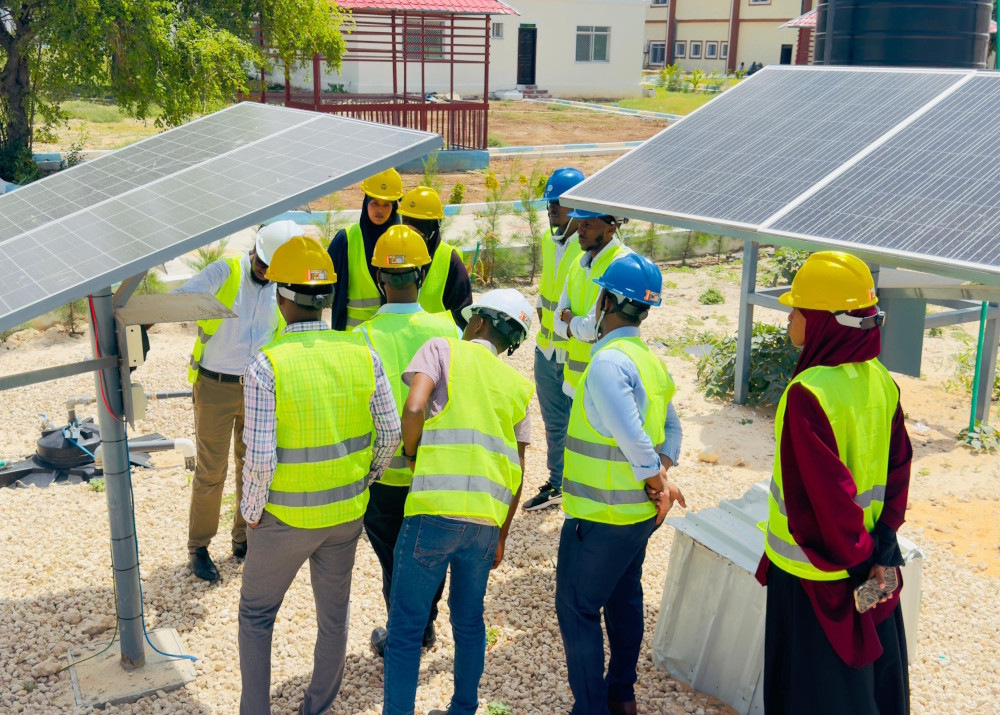 Workers receiving technical training for renewable energy jobs as part of a just transition strategy