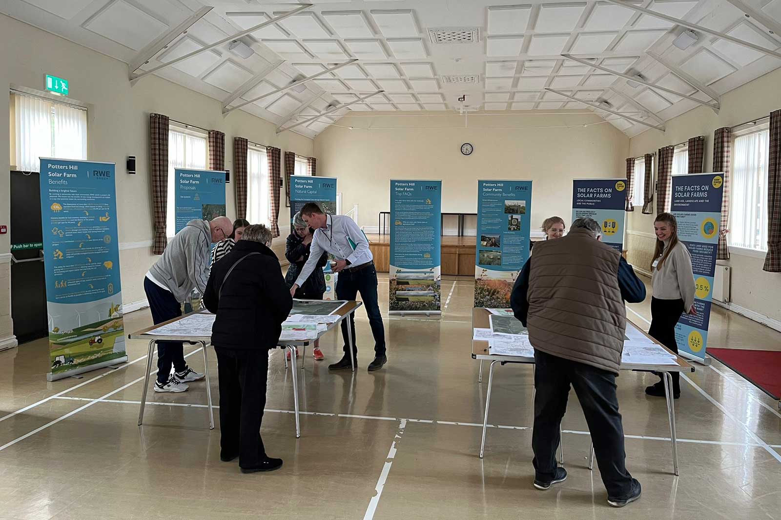 Community members reviewing an energy project during a stakeholder consultation and transition planning process